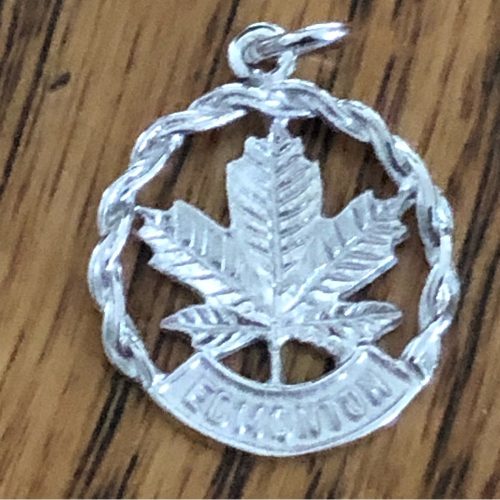 Edmonton Charm with maple leaf.  Very cute little vintage charm in great shape.